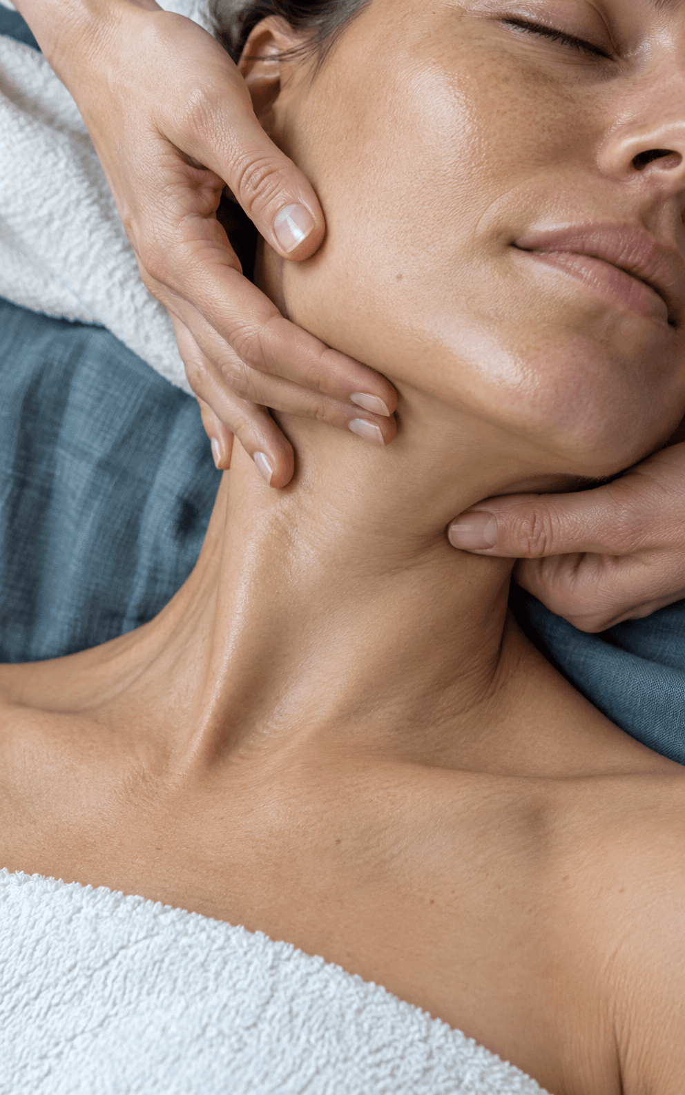 A gentle facial massage focused on the cheek and jawline